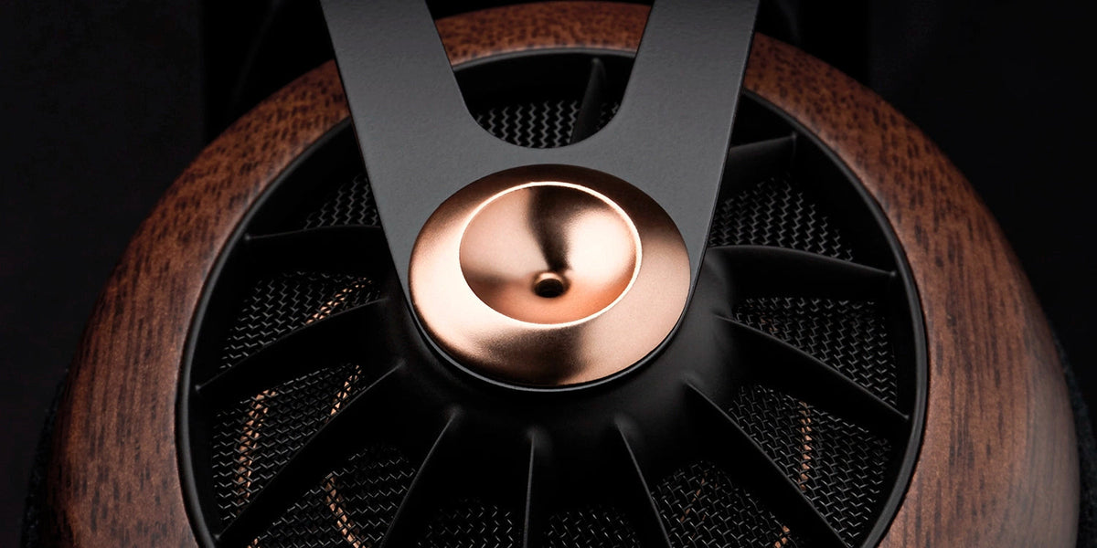 Meze Audio 109 PRO, close up of the walnut earcup and copper yoke pivot