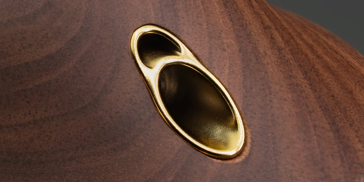 Meze Audio 99 CLASSICS (2nd Gen), close up of the walnut earcup and gold cable socket