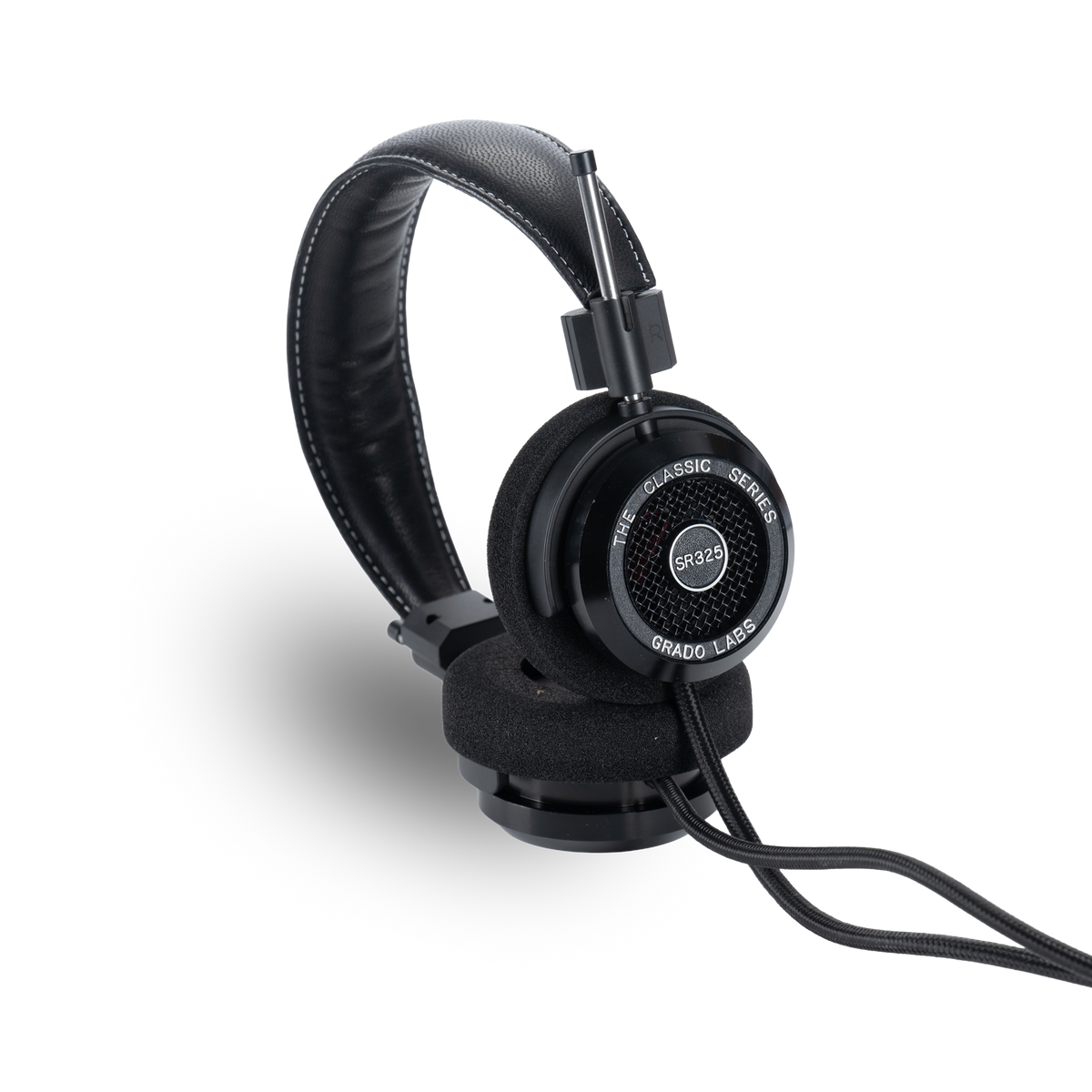 Grado SR325, lying on its side with the cable