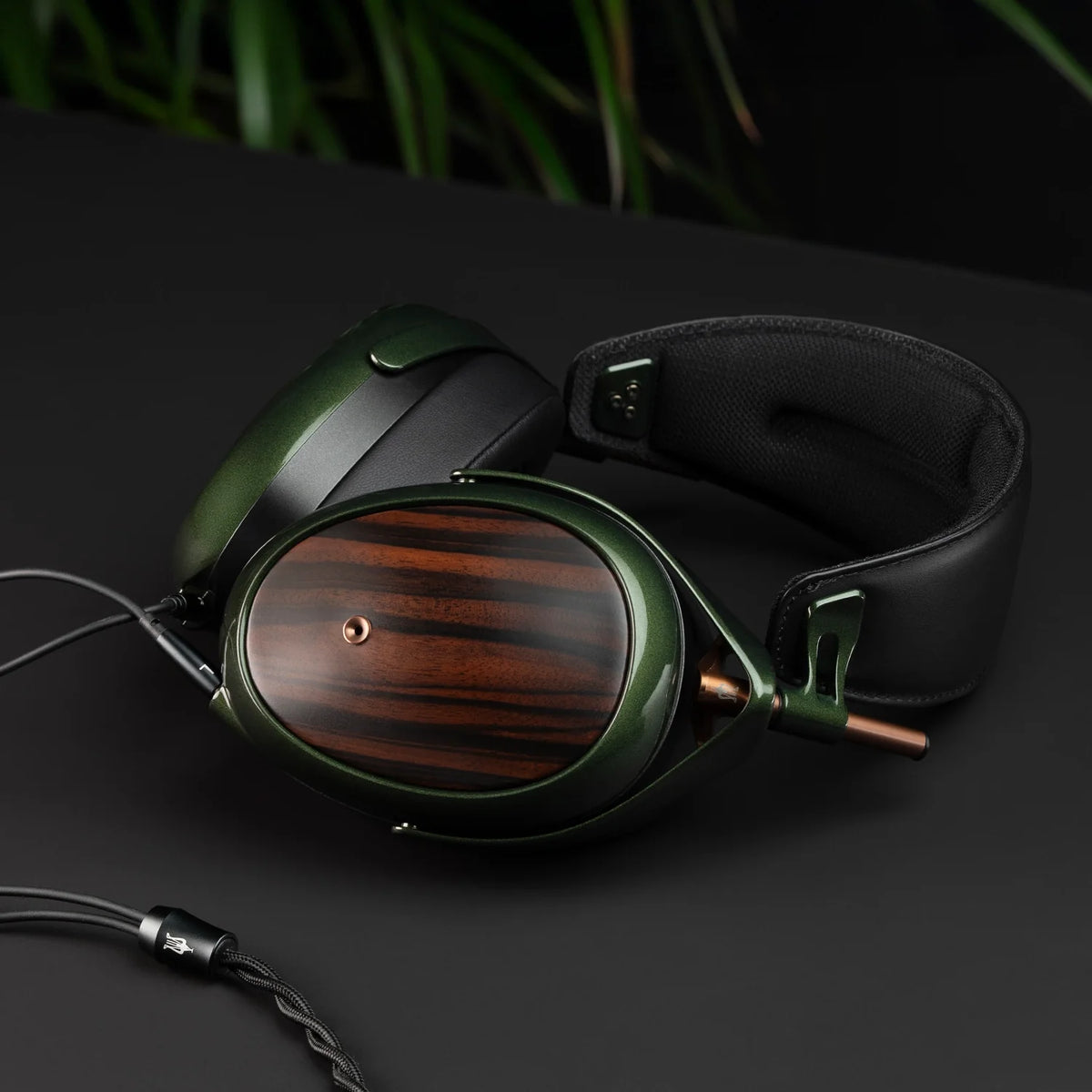 Meze Audio STRADA, lying on its side with the cable