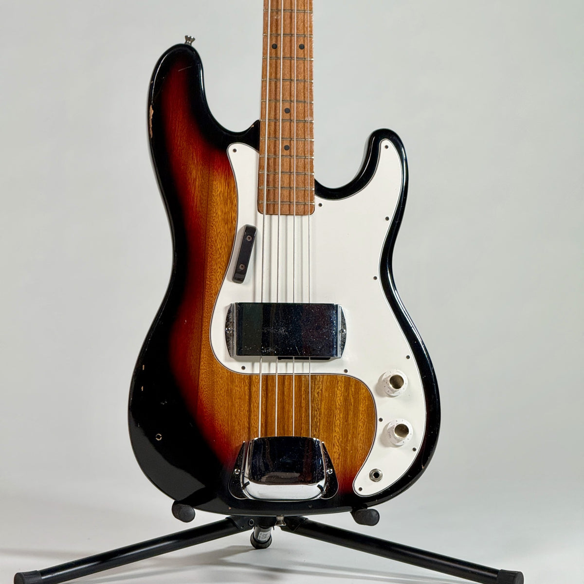 Used unbranded P-bass style bass in sunburst, front of the body