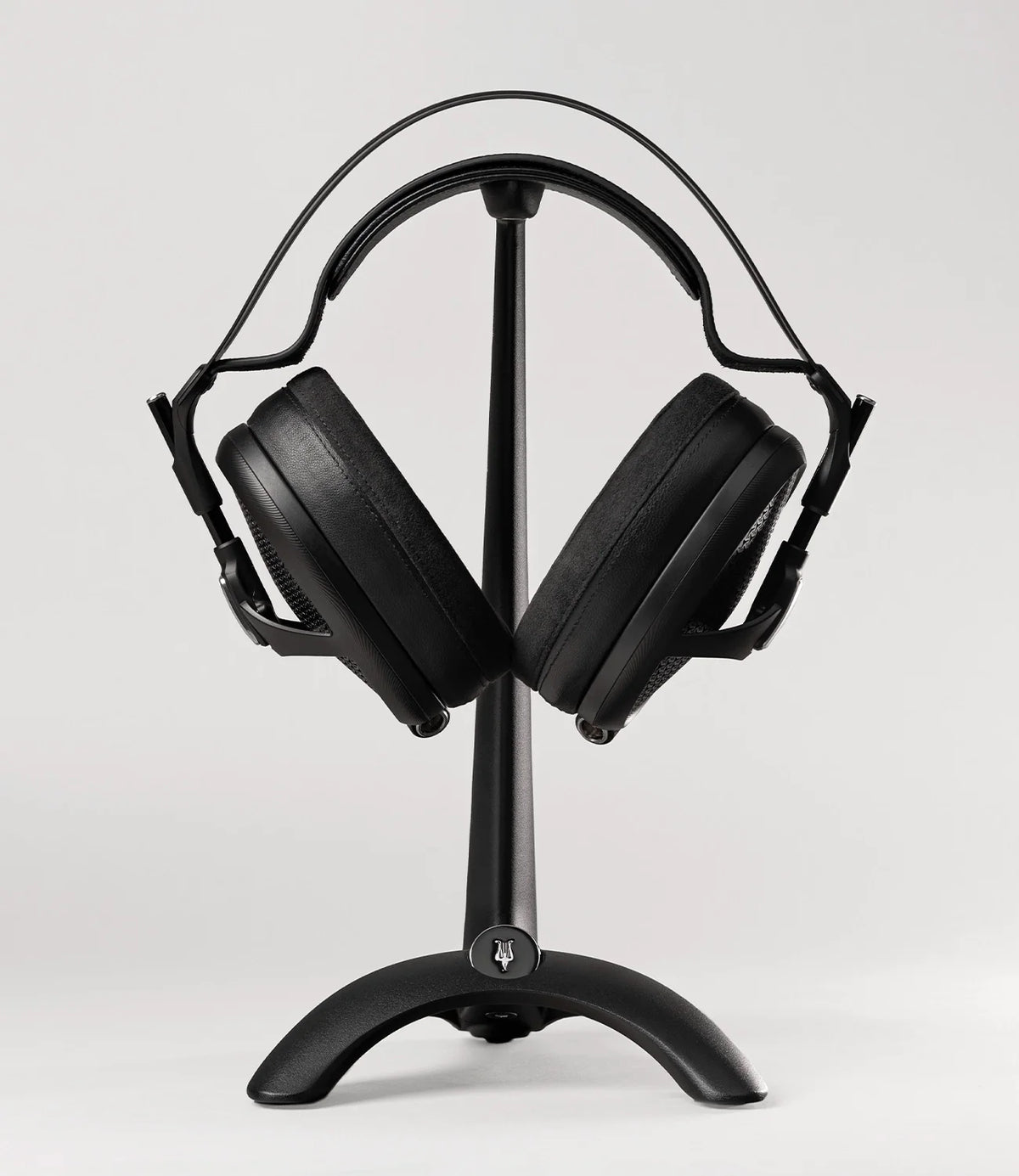 Meze Audio Manta Headphone Stand, front view, holding a headphone