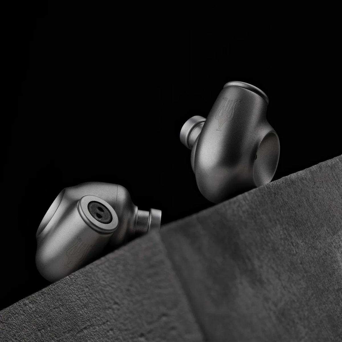 Meze Audio ASTRU, the pair on a dark surface
