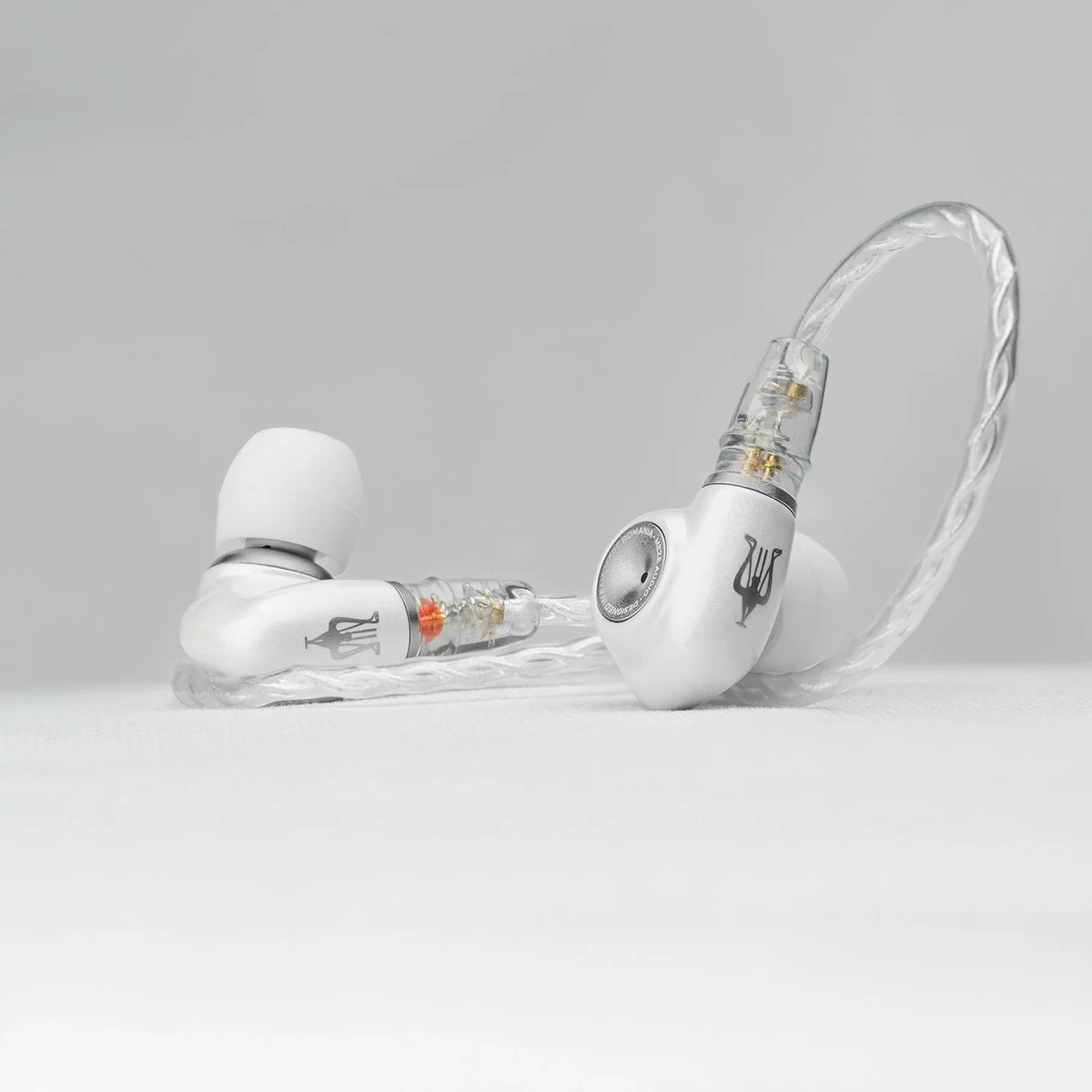 Meze Audio ALBA S, lying on a table with the cable