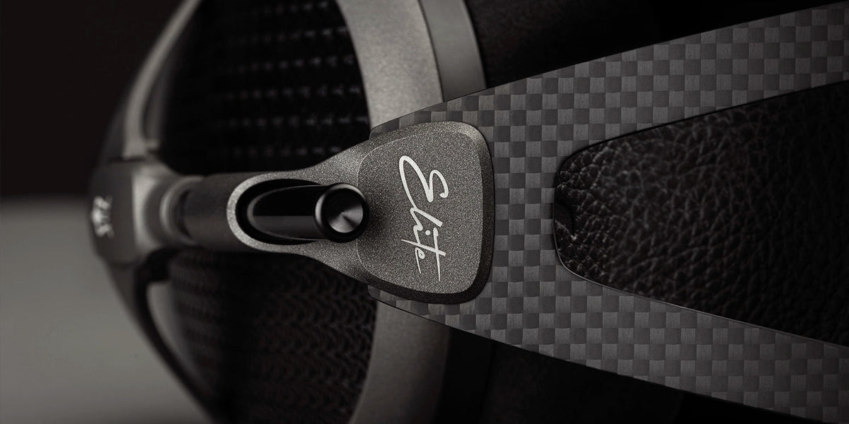 Meze Audio ELITE Tungsten, close up of the carbon fiber headband and the Elite badge