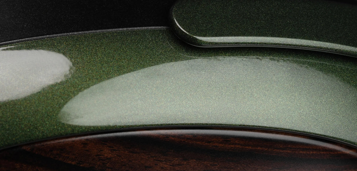 Meze Audio STRADA, close up of the green frame over the wood earcup