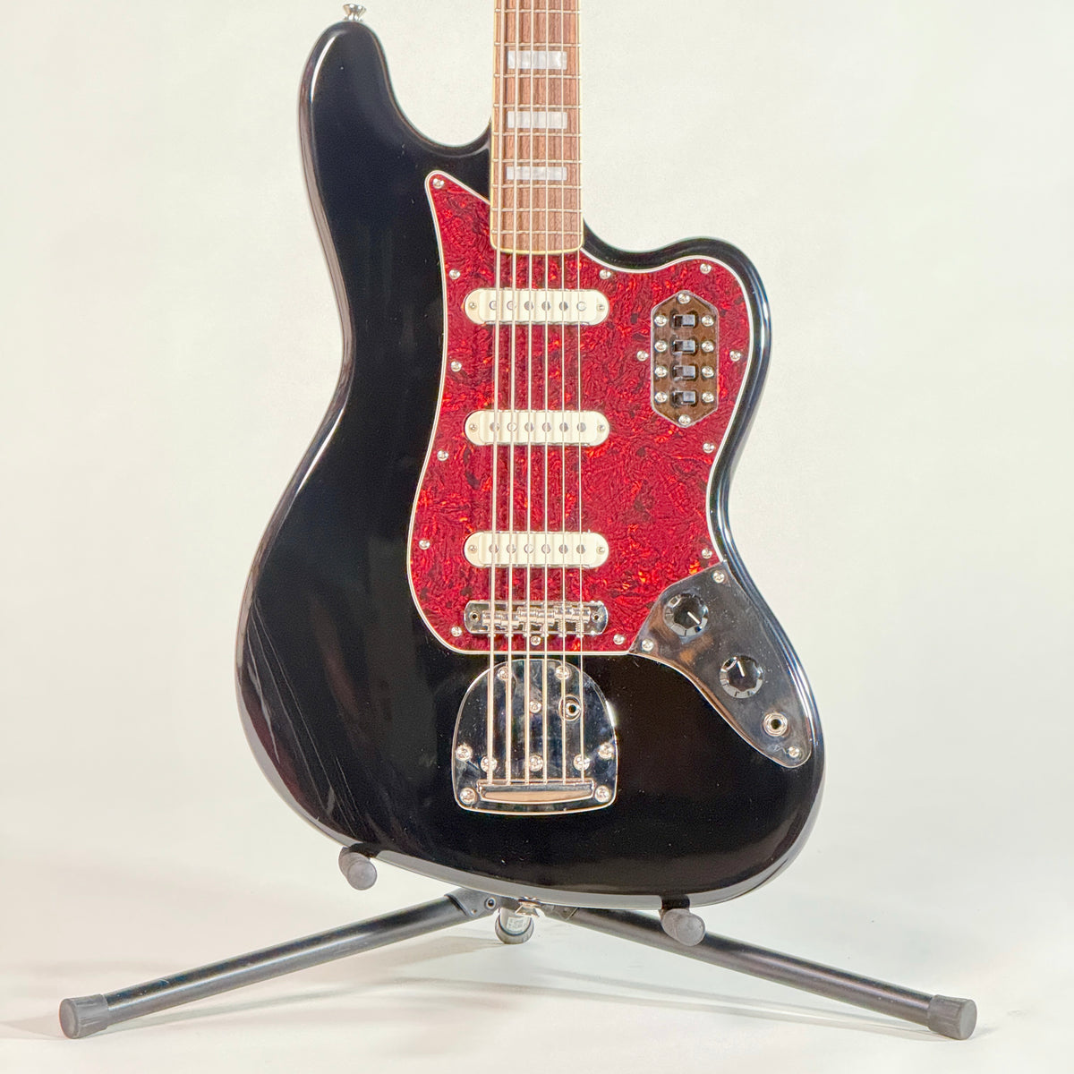 Used Squier Bass VI in black, front of the body