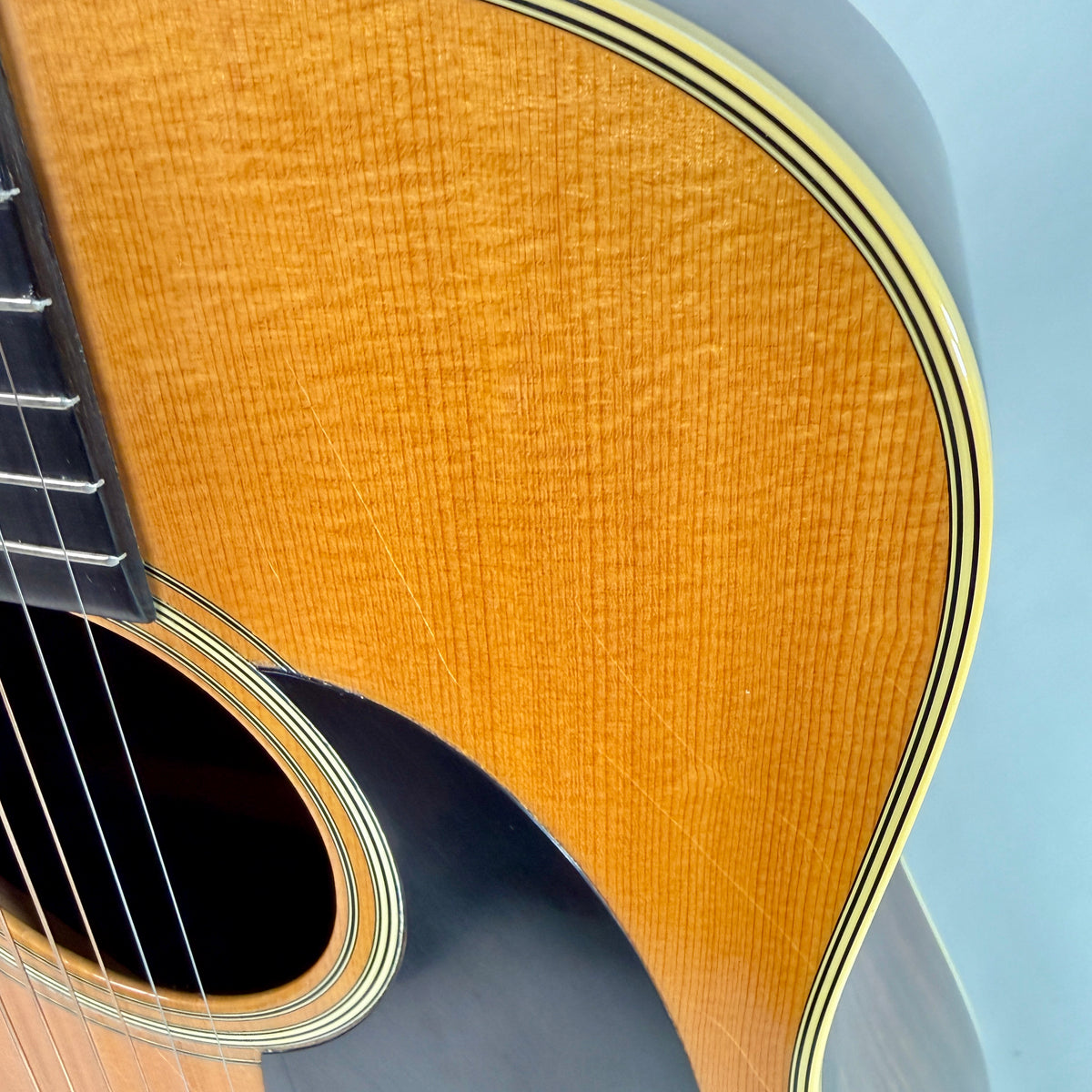 Used 1976 Martin D-28, close up of the top and binding at the upper bout
