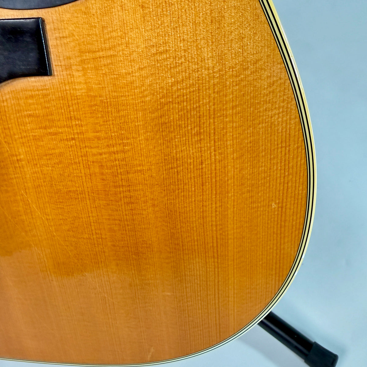 Used 1976 Martin D-28, close up of the top and binding on the treble side