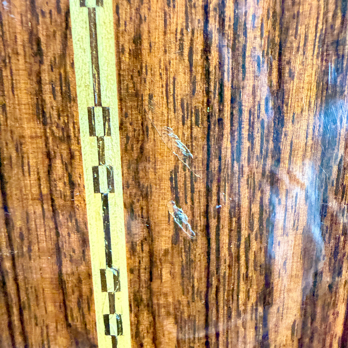 Used 1976 Martin D-28, close up of marks on the rosewood back
