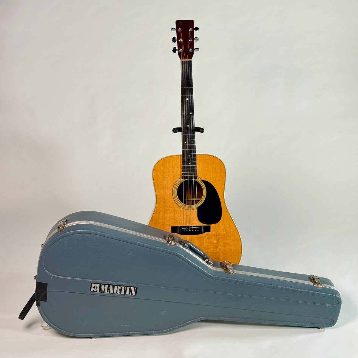 Used 1976 Martin D-28, standing behind its Martin hardshell case