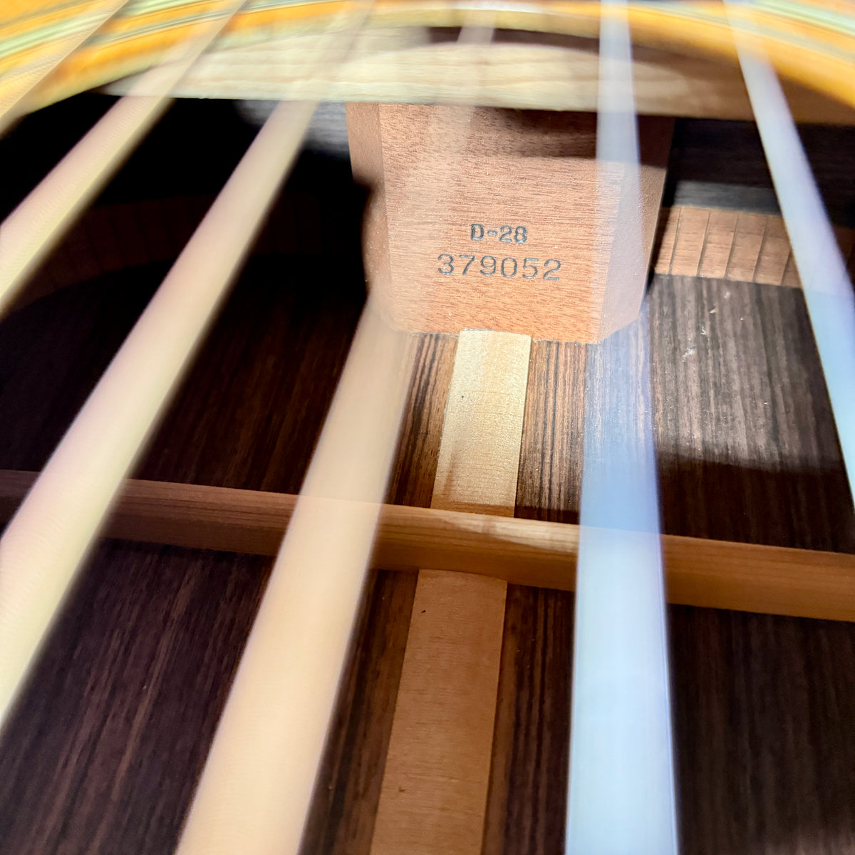 Used 1976 Martin D-28, the neck block stamp at a steeper angle, with a back brace and the center strip below it