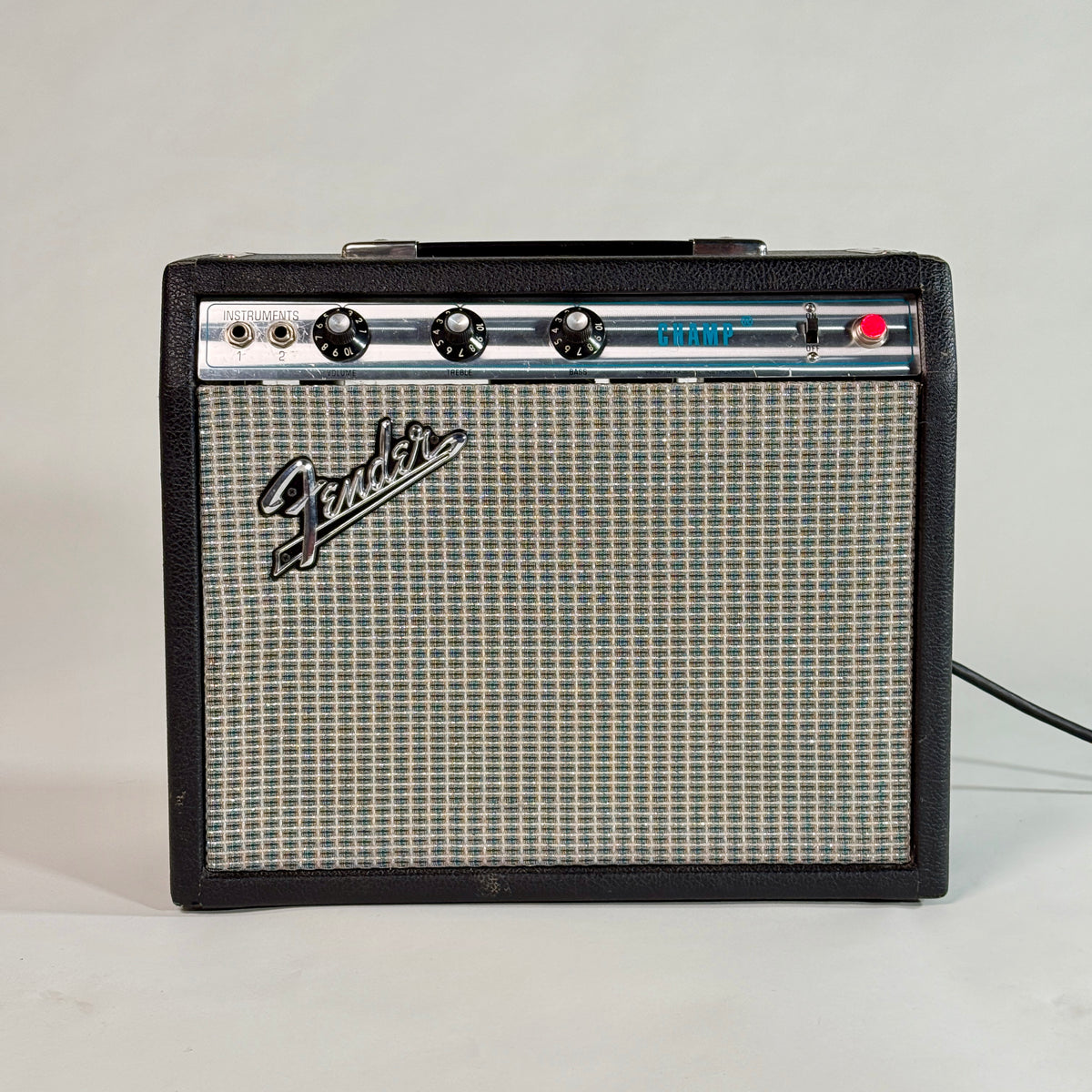 Used silverface Fender Champ, front of the amp