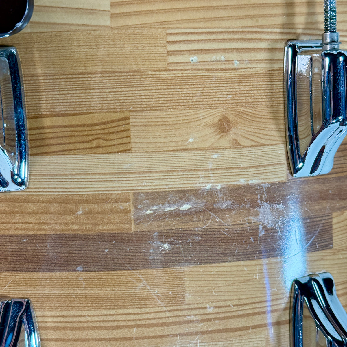 Used Rogers three-piece drum kit in natural, close up of wear on the wrap