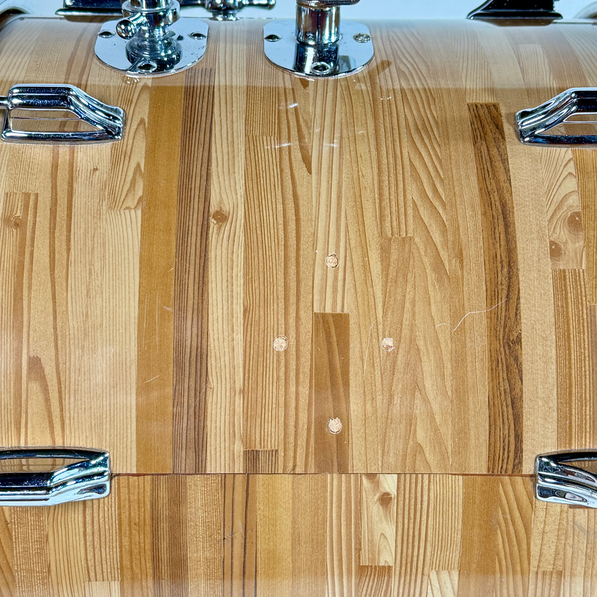Used Rogers three-piece drum kit in natural, close up of the wrap on the kick shell
