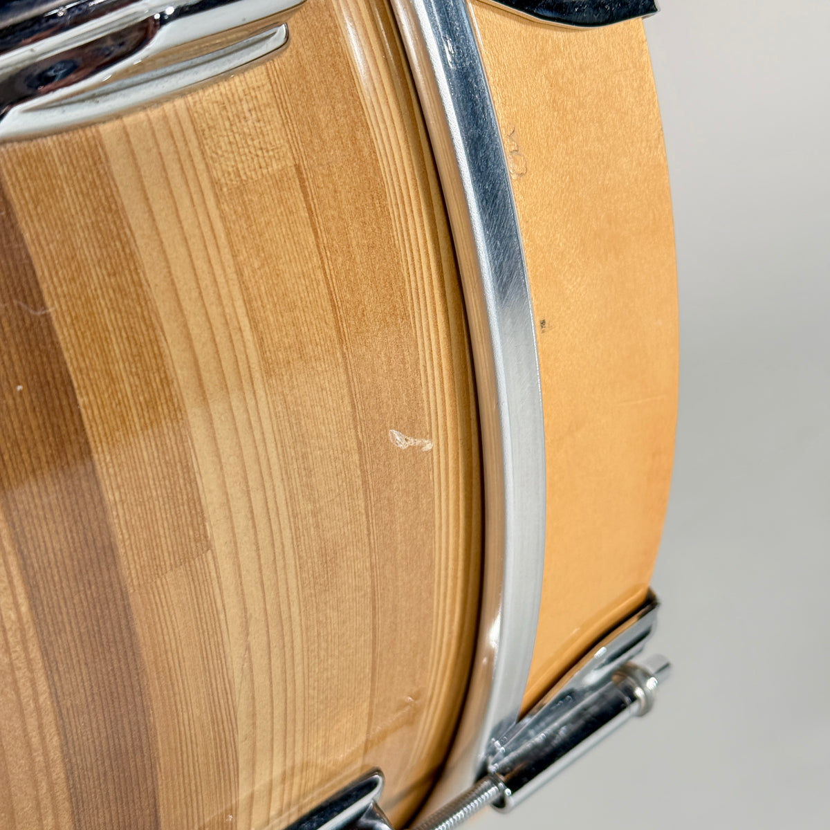 Used Rogers three-piece drum kit in natural, close up of the kick hoop and wrap edge