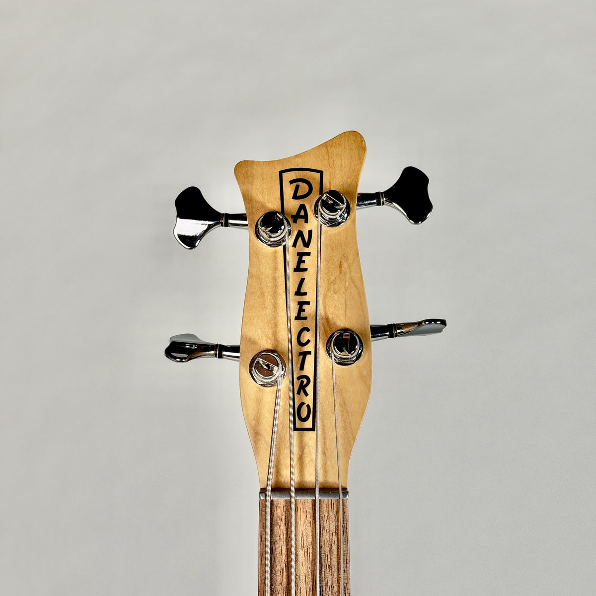 Used Danelectro Hodad bass in Blue Metalflake, front of the headstock