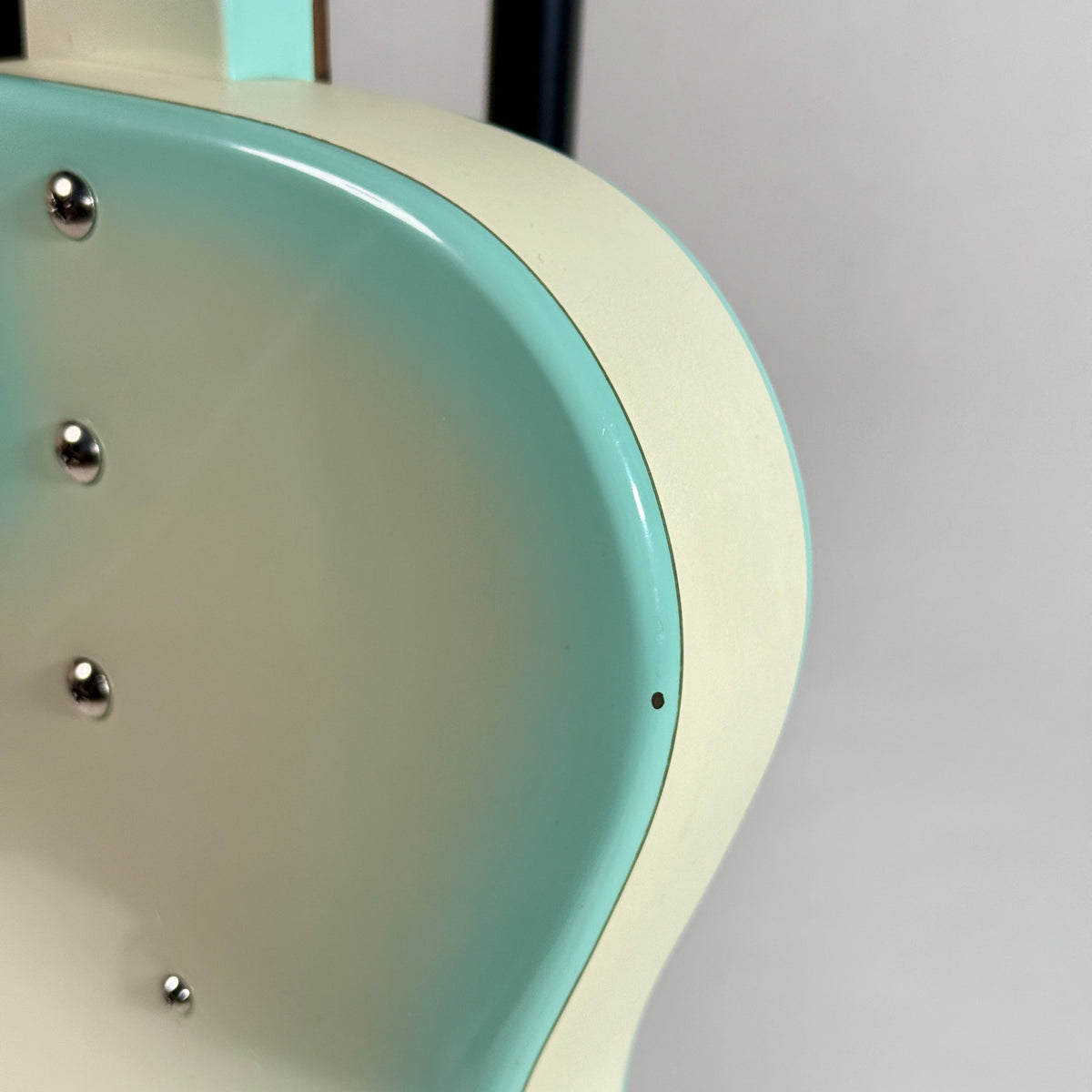 Used Danelectro '56 U-2 reissue in Aqua Burst, close up of the finish at the body edge
