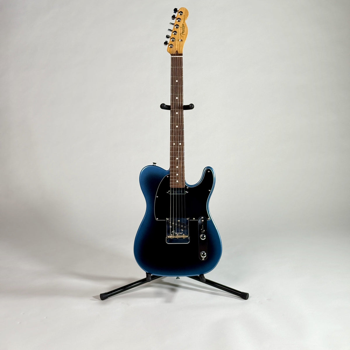 Used 2021 Fender American Professional II Telecaster in Dark Night, full length, front, on a stand