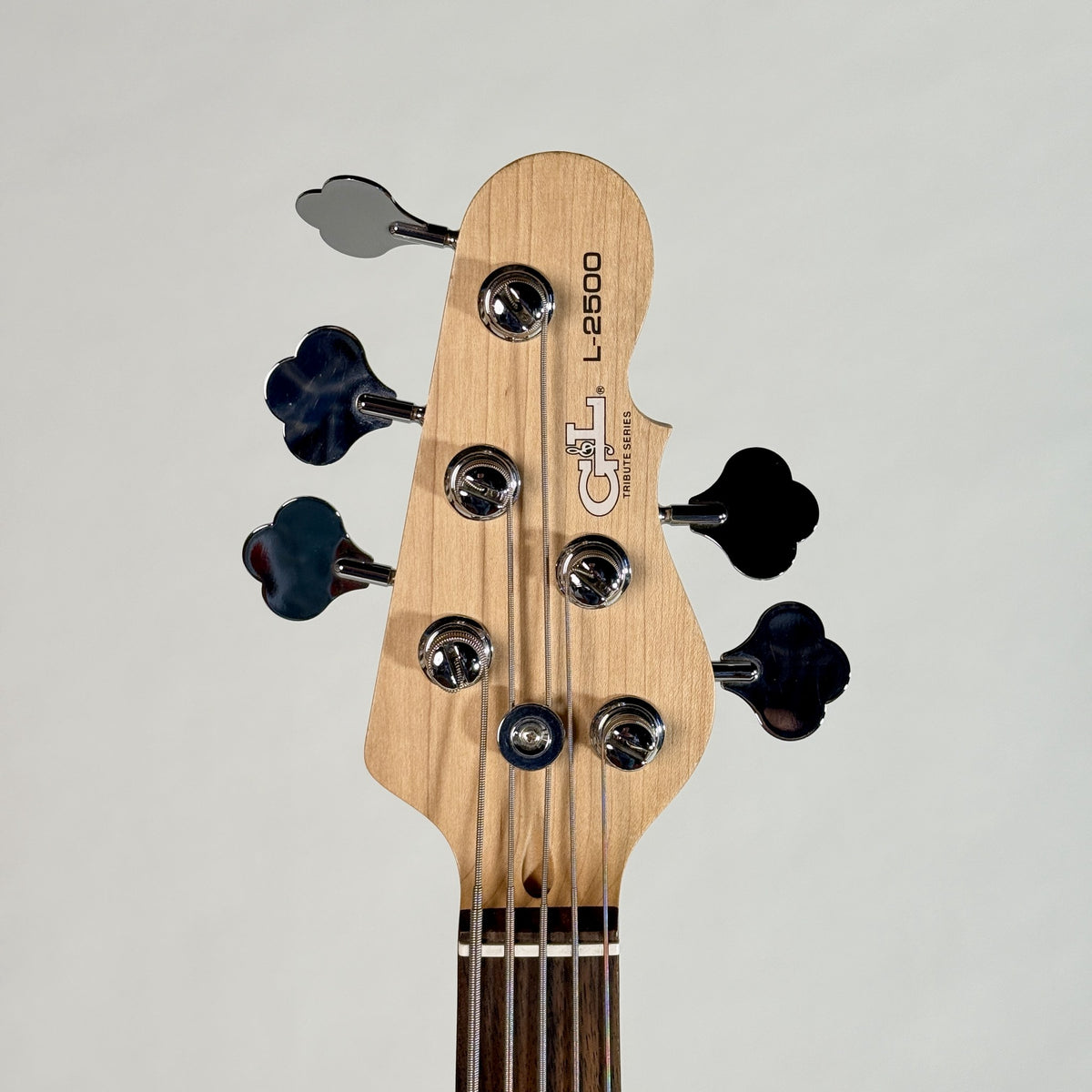 Used G&L Tribute L-2500 five-string bass, natural, front of the headstock