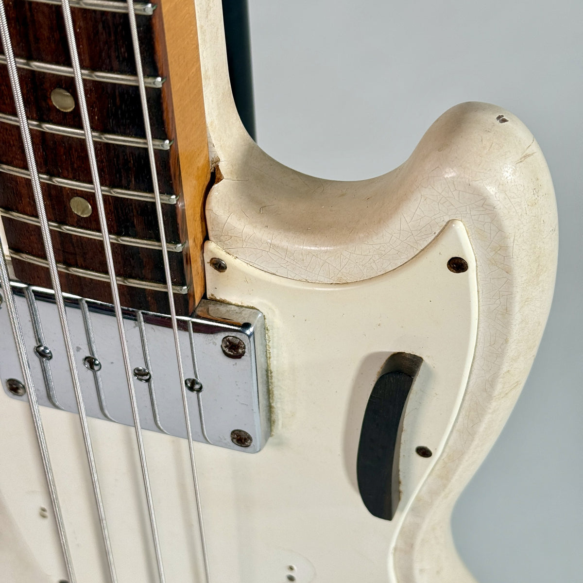 Used Kalamazoo bass in white, close up of the pickup and upper horn