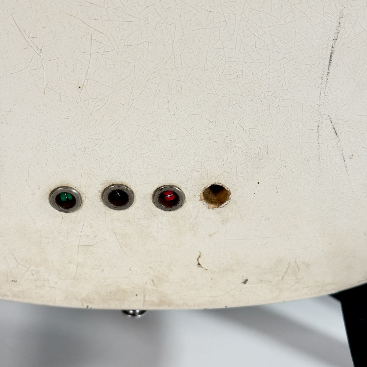 Used Kalamazoo bass in white, close up of the string ferrules and finish wear