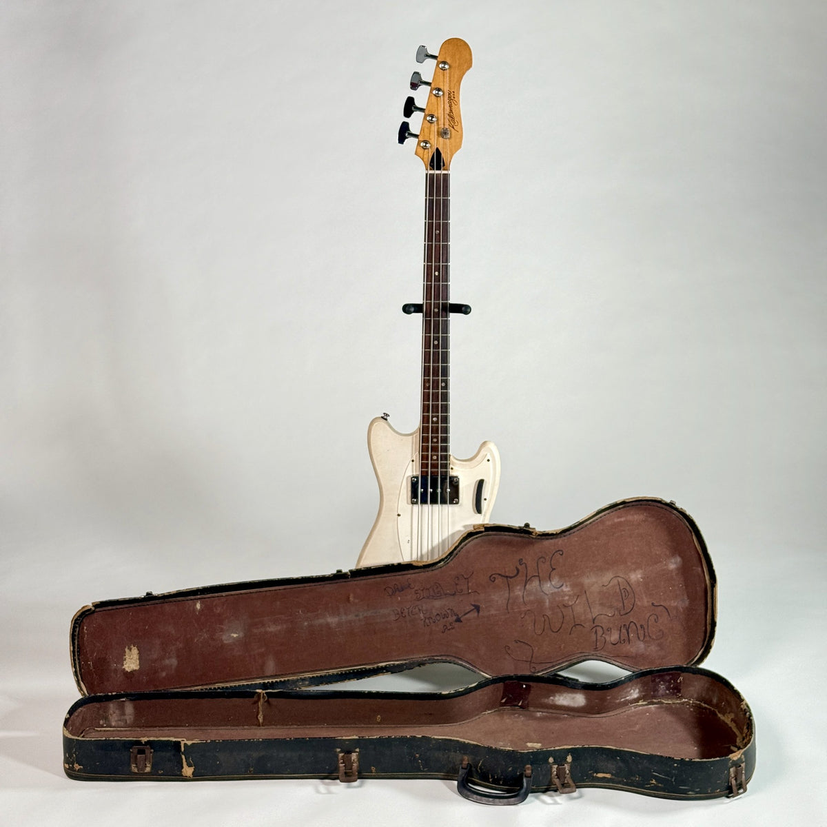 Used Kalamazoo bass in white, standing behind its open case
