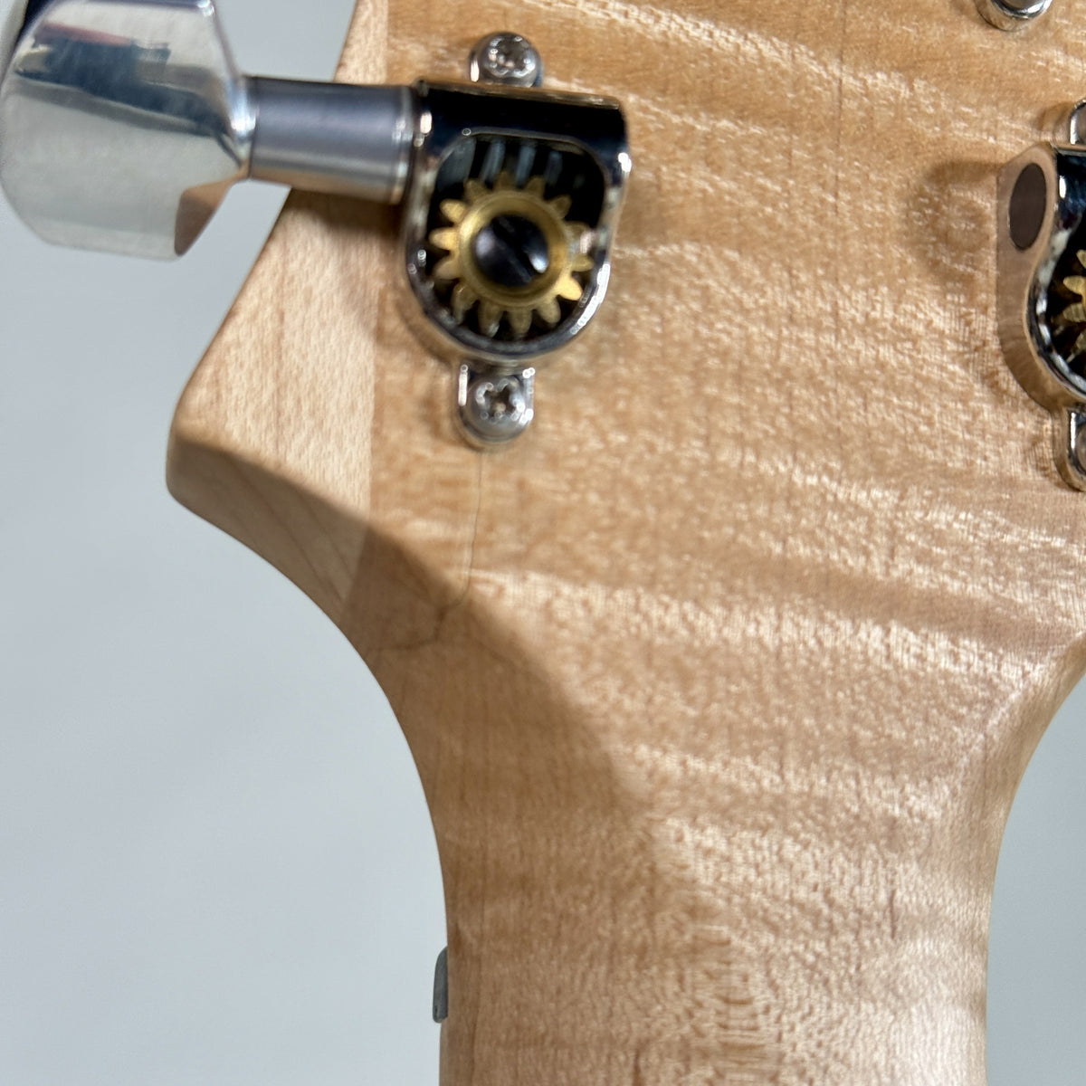 Used 2012 PRS NF3 in Antique White, close up of the flamed maple at the back of the headstock