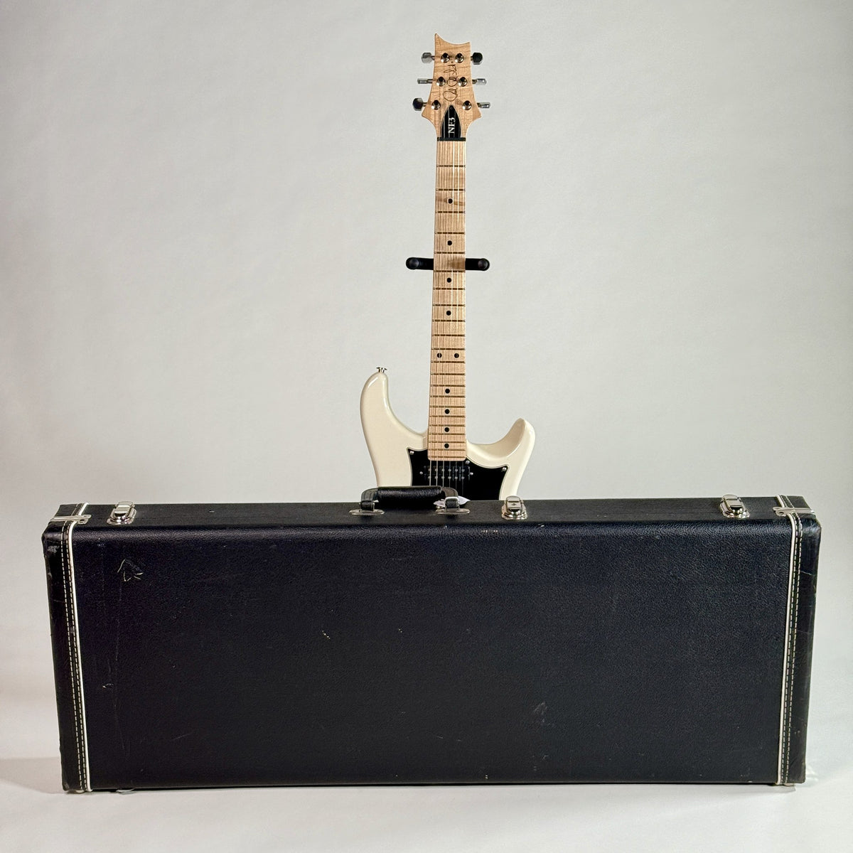 Used 2012 PRS NF3 in Antique White, standing behind its hardshell case