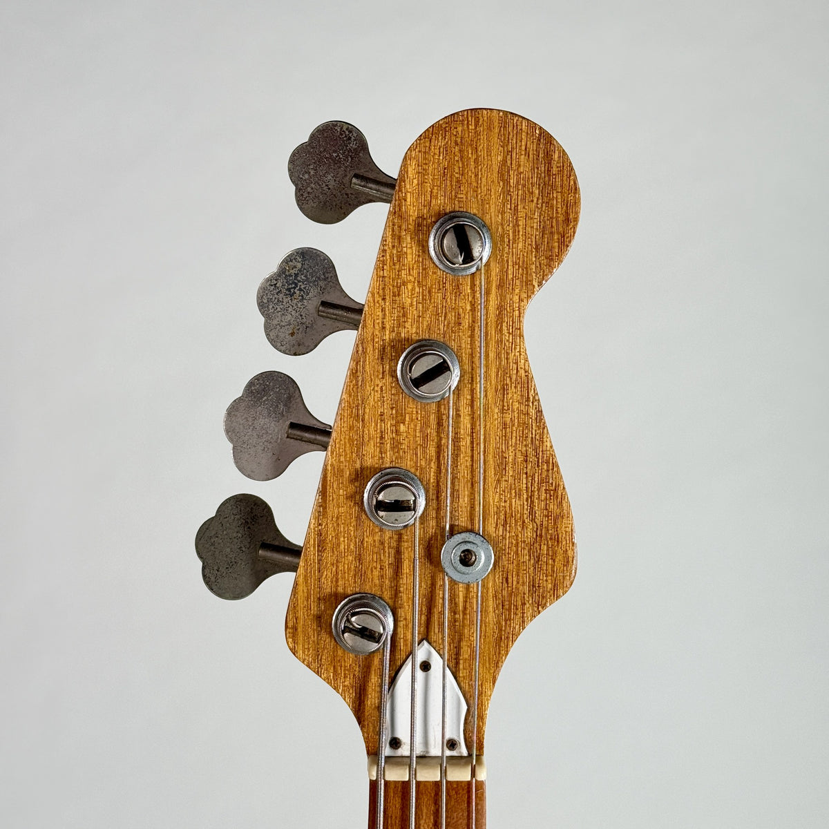Used unbranded P-bass style bass in sunburst, front of the headstock