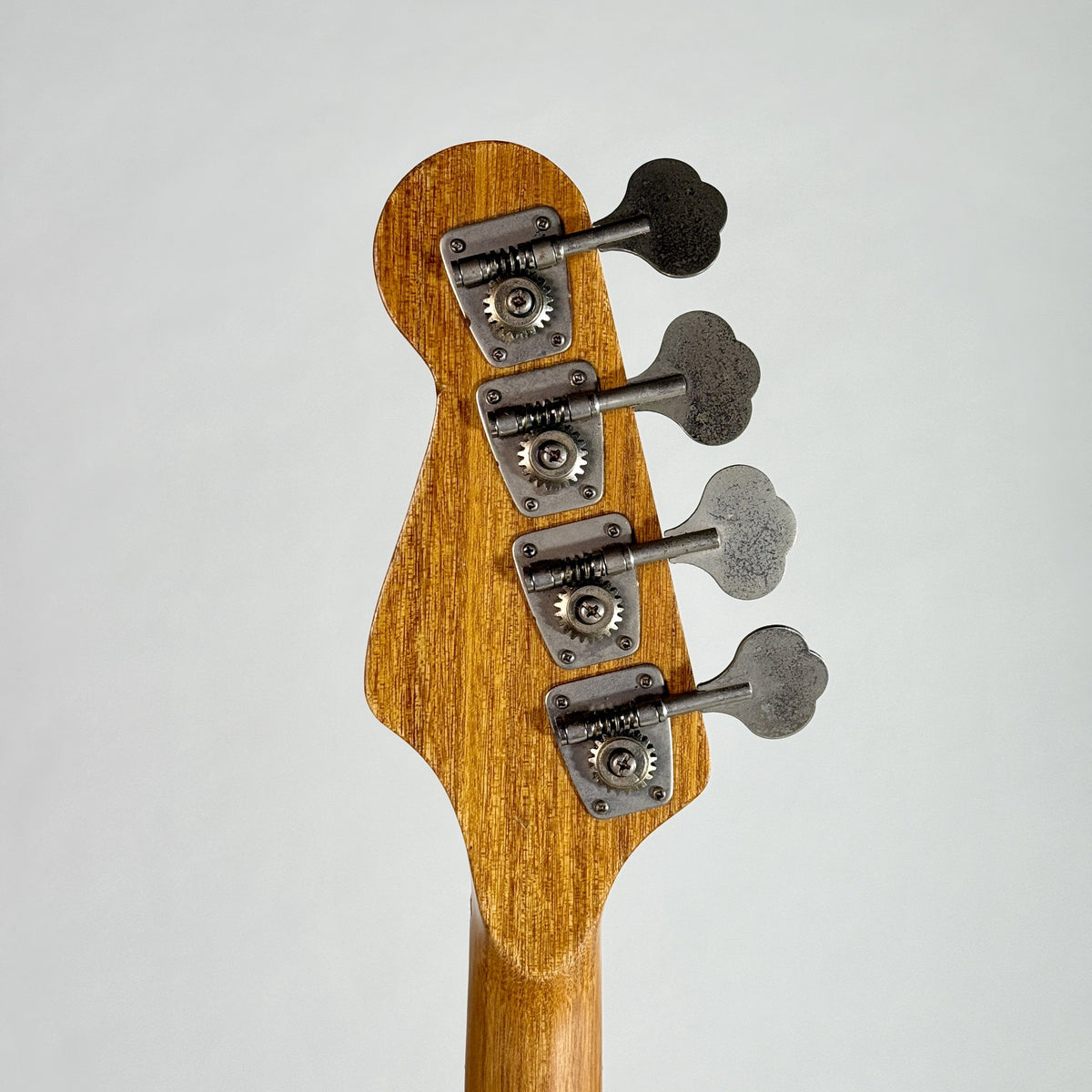 Used unbranded P-bass style bass in sunburst, back of the headstock