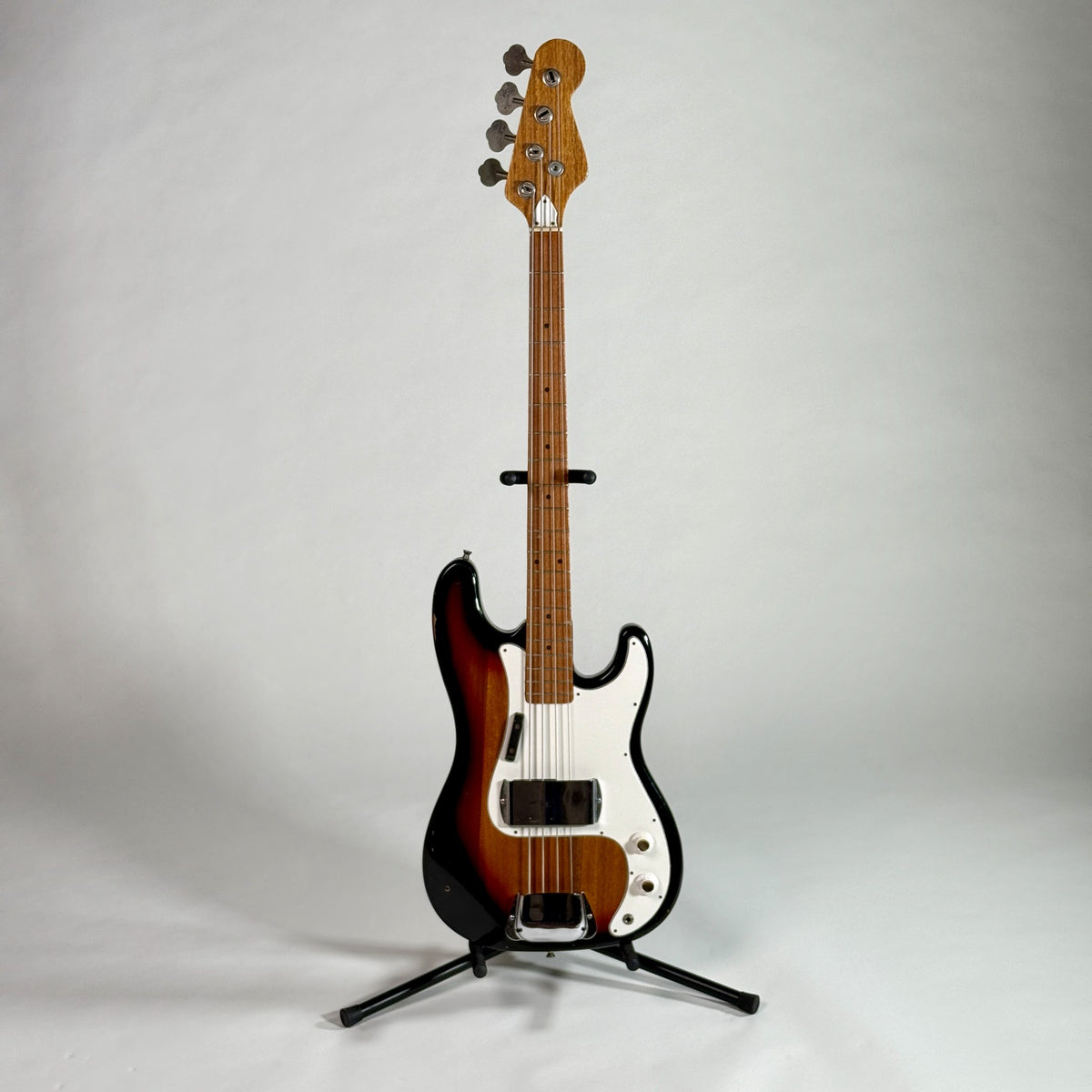 Used unbranded P-bass style bass in sunburst, full length, front, on a stand