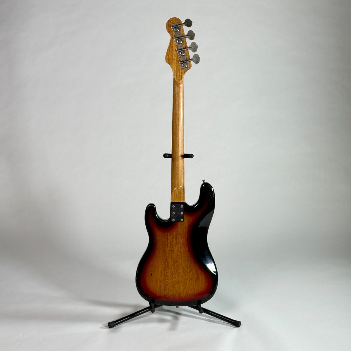 Used unbranded P-bass style bass in sunburst, full length, back