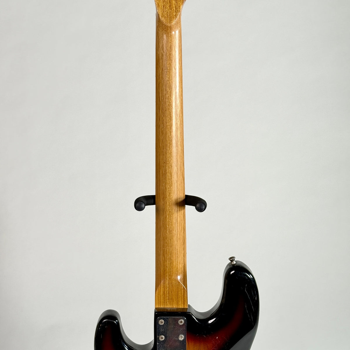 Used unbranded P-bass style bass in sunburst, back of the neck
