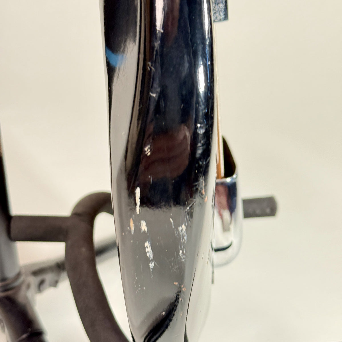 Used unbranded P-bass style bass in sunburst, close up of the finish wear on the body edge