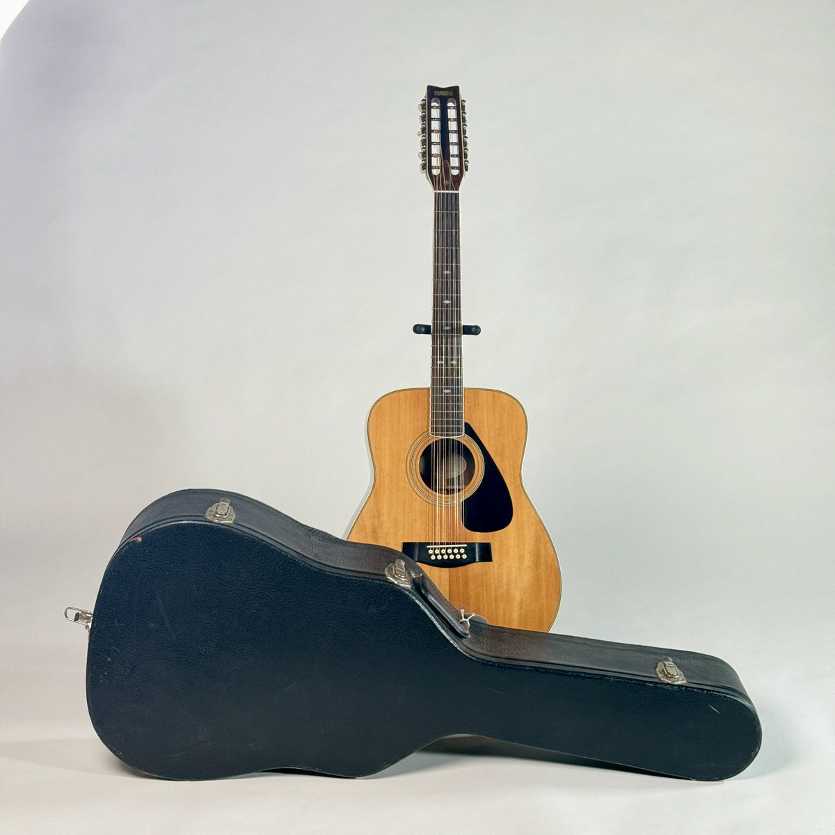 Used Yamaha FG-512 12-string dreadnought, standing behind its hardshell case